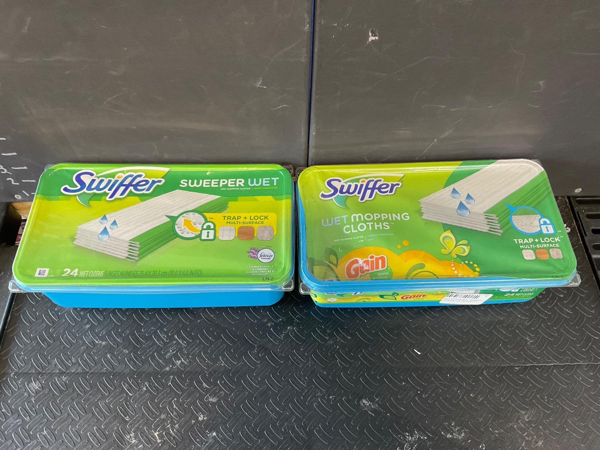 Two packs of swiffer wet mopping cloths opened