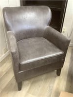 Gray rustic studded arm chair.  Matches lot 6