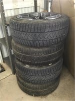 Four Sottozero 3 tires with rims.  235/45 R18