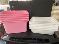 Pink and white storage bins plastic.