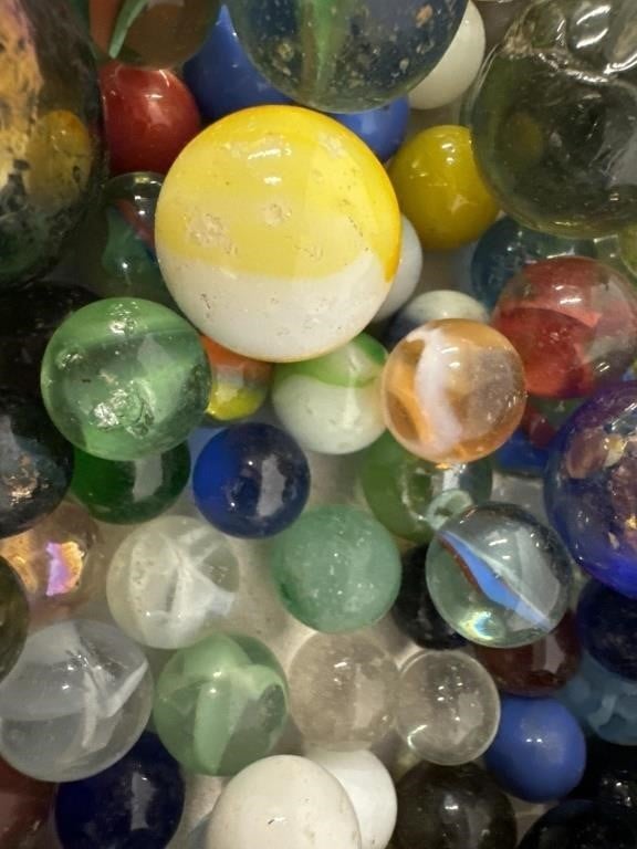Boxed lot of vintage marbles. Various sizes and