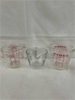 3 - 2 cup glass measuring cups. One Fire -