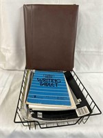 Office writing supplies in a metal file basket