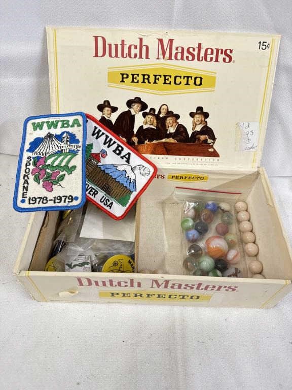 Cigar box with marbles patches, and pens