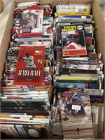 Box full of appears to be mostly baseball cards.