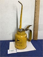 Vintage yellow John Deere oil can