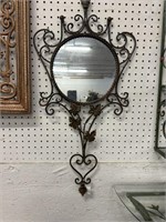 Round mirror in wrought iron frame. 31 inches