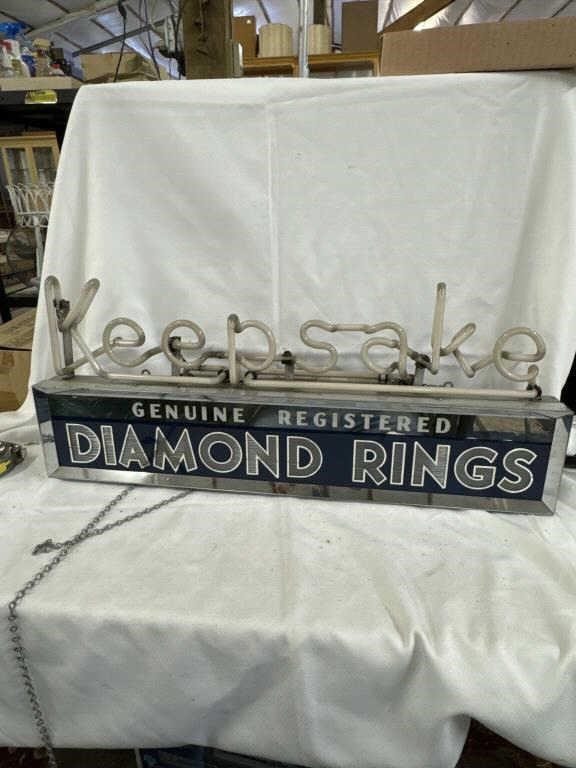 Keepsake, diamond rings, neon sign. And the
