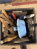 Milk crate with lot of various brushes and dust