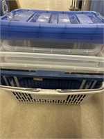 Stack of shopping baskets and plastic bins with