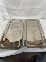 Pair of heavy silver colored trays. 17” x 7 1/2”.