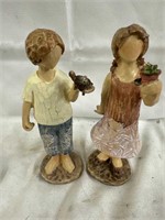Garden couple statues of boy and girl 8” high.