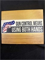 6” by 7” wooden plaque “GUN CONTROL MEANS USING