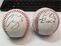 E4)Two autographed baseballs, authenticity unknown