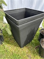 Two planters about 24 inches tall and 16 in.²