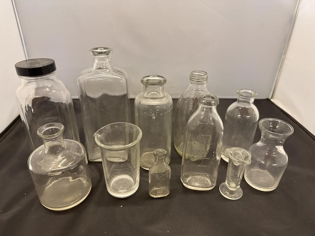 Assorted lot of glass jars and measuring bottles