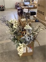Box of artificial flowers and decor