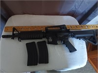 E2)Colt Airsoft Electric Rifle has 2 magazines,