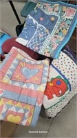 Tub of blankets and quilts - on cart 49