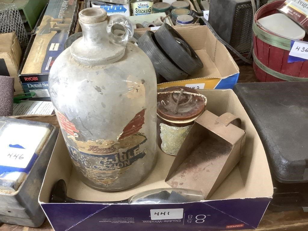 Old glass jug.  Metal scoop