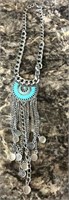 Beautiful necklace with turquoise center possibly