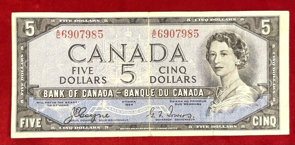 1954 Canadian $5 bill w/ the devil's face.