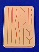 SUTURE PAD FOR PRACTICING WOUND CLOSURE
