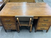 Large wooden desk with chair