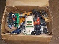 Assorted toy cars, wheels, parts