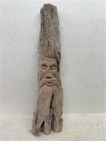 Wood carved face sculpture