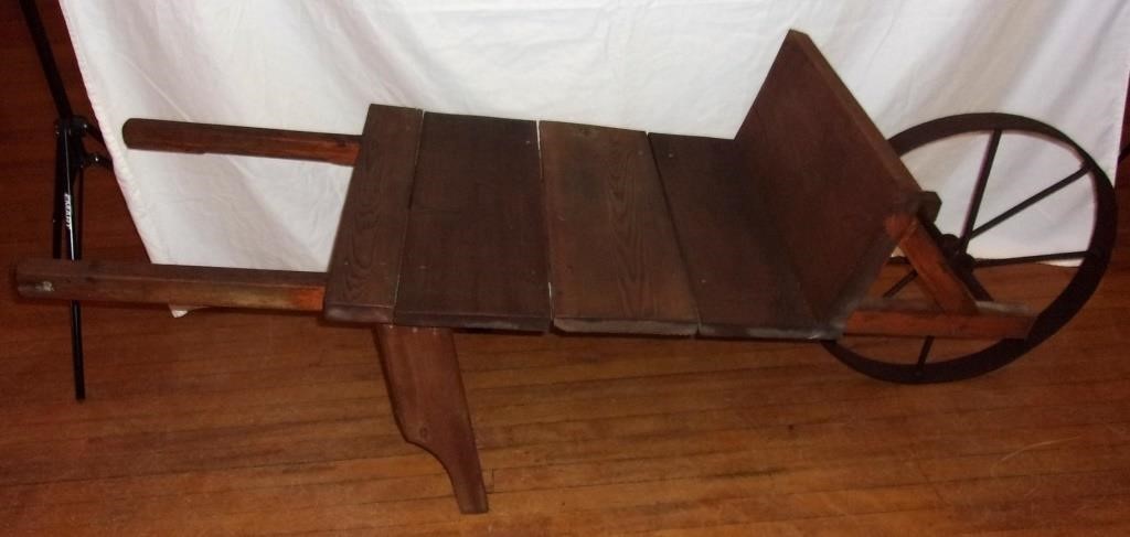 Rustic wooden wheelbarrow.
