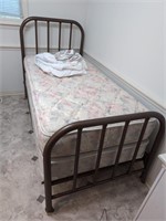 Vintage iron heavy twin bed on rollers and
