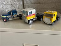 Vintage ERTL & Nylint toy trucks.
