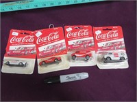 Four Coca-Cola Metal Cars in Bubble Packs