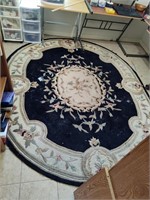 9' x 7' Oval Decorated Wool Rug