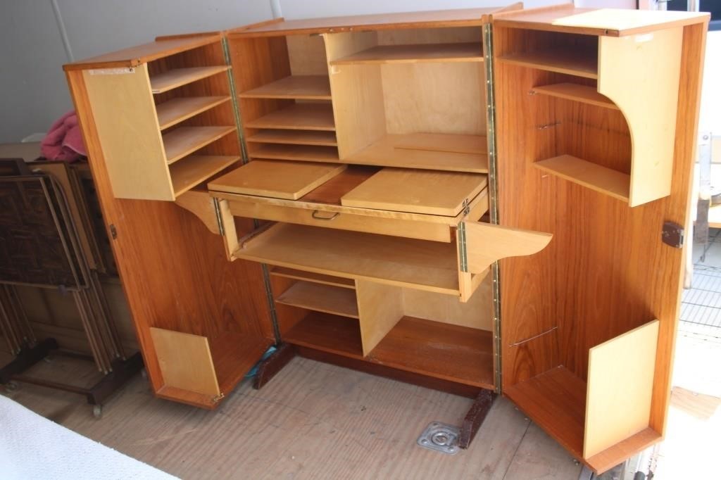 Desk within cabinet