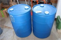 two plastic 30 gallon empty barrels