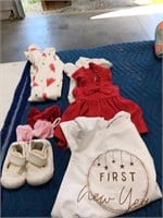 A sort of baby clothe, bows, size 14 shoes