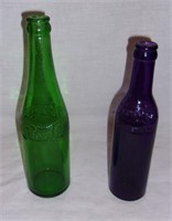 Vintage coloured Pepsi bottles.