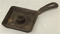 Vintage cast iron candle stick holder.