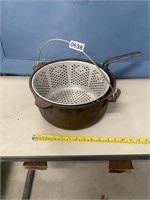 Cast iron pot with fryer basket
