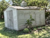 10 x 12 plastic Snap-it storage shed on wood