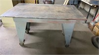 Metal rolling table 59” x 34”, 35” high 3/4” top