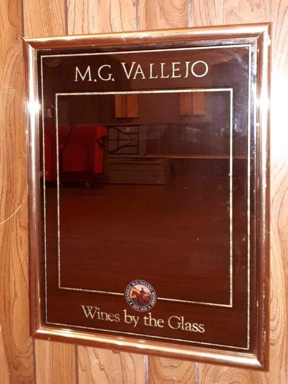 Vintage M.G Valleio wine mirror.