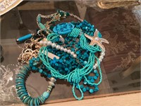 Bag of turquoise color jewelry