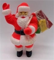 Small plastic Santa with bag of plastic cars