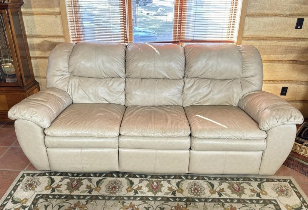 Cream colored leather reclining sofa