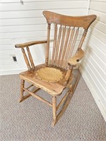Antique rocking chair bird motif seat
