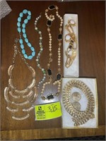 GROUP OF COSTUME JEWELRY BRACELETS , NECKLACES, PI