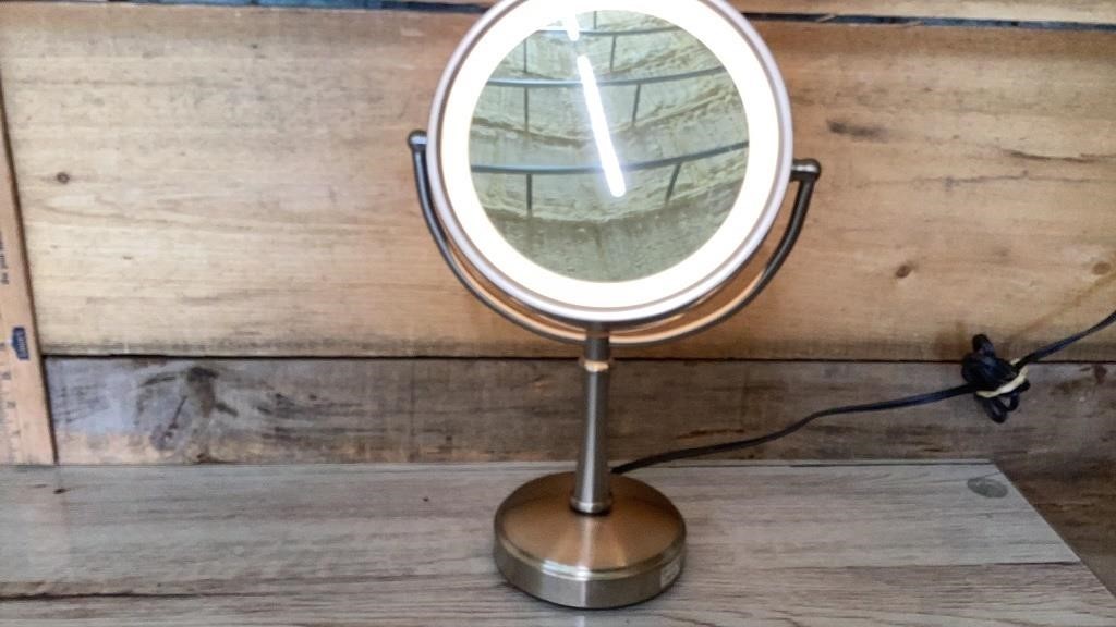 Brushed nickel lighted, magnifying mirror